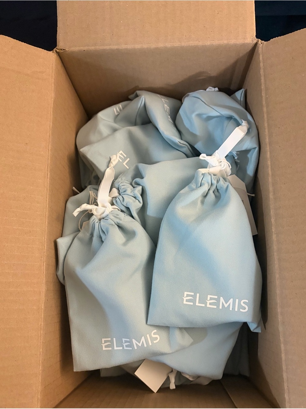 BULK LOT- ELEMIS Powder Blue Drawstring Pouches with travel sized product.